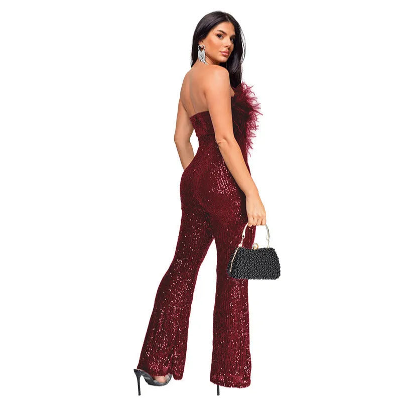 Women's sleeveless backless jumpsuit with flared legs and sequin detail in wine red.