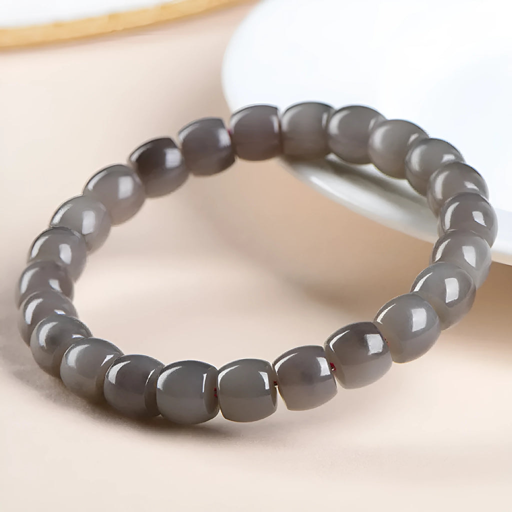 Natural smokey violet Hetian jade straight cut bead bracelet on a wrist