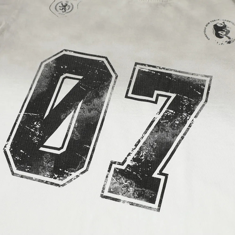 Men's black and white printed short-sleeved cotton T-shirt laid flat.