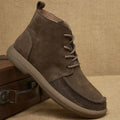 Grey genuine leather women's Martin boots with wedge heel and front lace-up design.