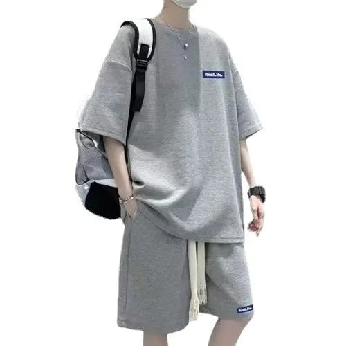 Waffle-textured leisure sports suit in blue, showing short sleeve top and matching shorts.