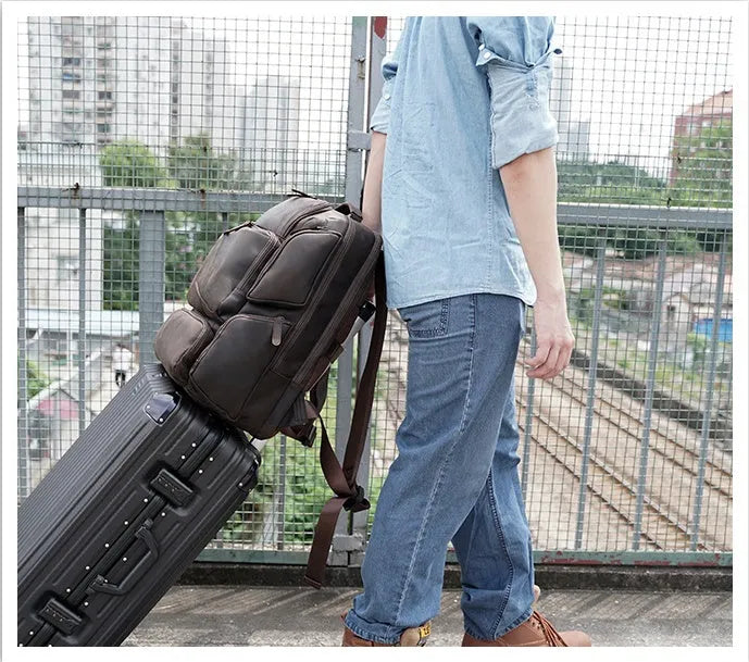 Dark brown genuine leather backpack with 17-inch laptop compartment and double shoulder straps