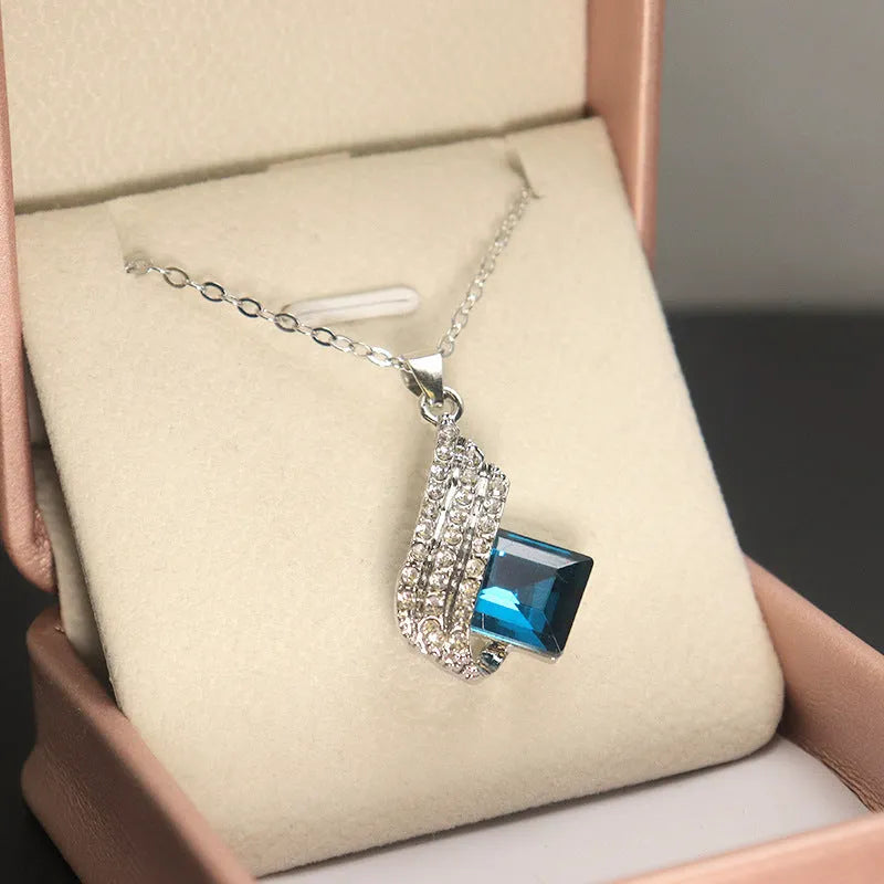 Glass pendant and alloy cross chain necklace with matching electroplated ear studs jewellery set in two style colours.