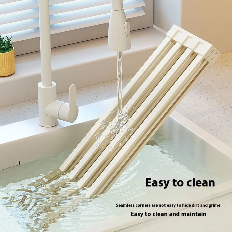 Milky White foldable stainless steel kitchen draining rack shown folded and unfolded.