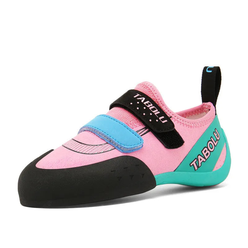 Black and red beginner rock climbing shoes with Velcro closure and rubber outsole