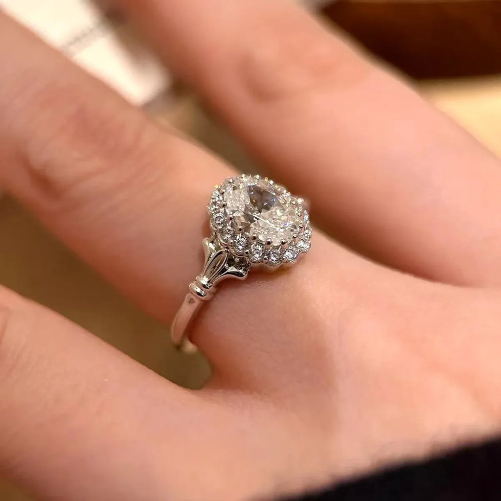 Silver geometric women's ring with large diamond centrepiece and adjustable opening.