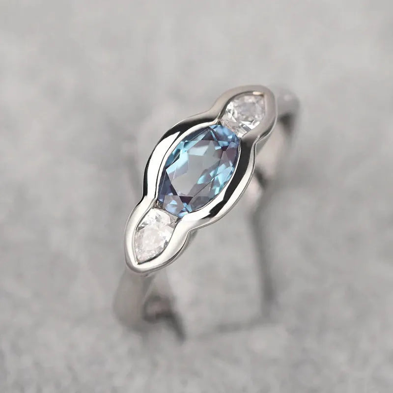Geometric ellipse women's ring with zircon inlay in white gold colour plating