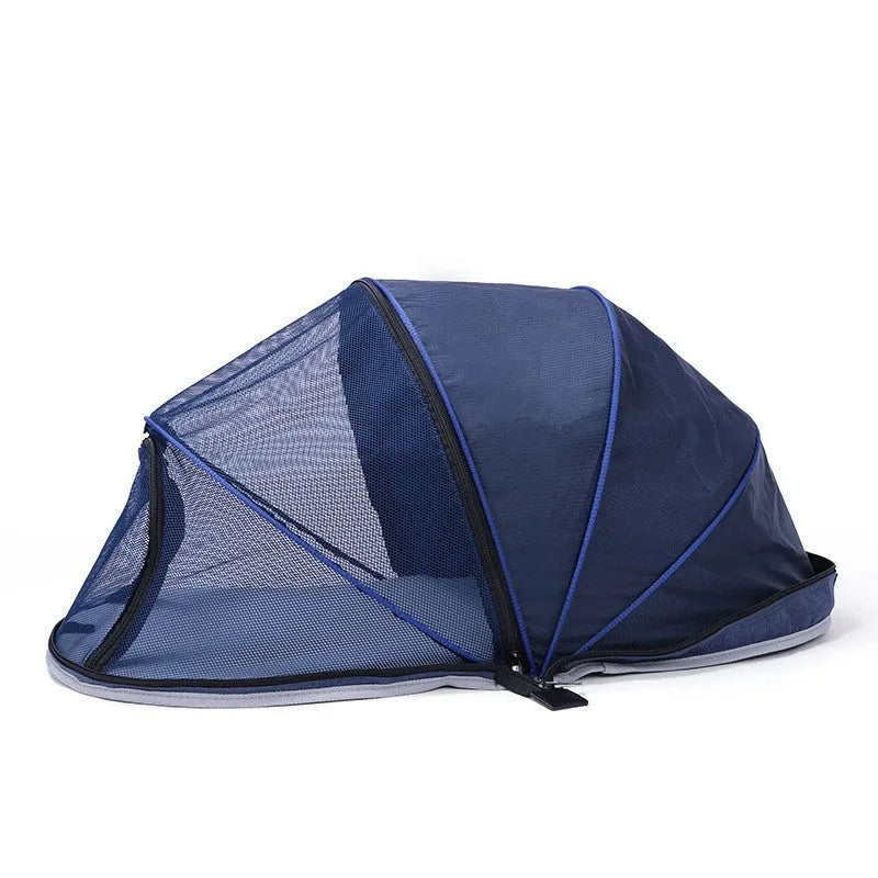 Blue half mesh folding pet tent for cats, shown in a collapsed and portable state.