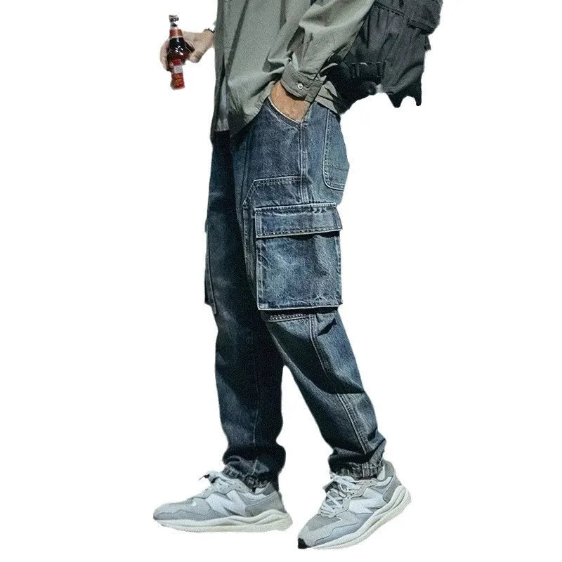 Men's blue loose straight retro style polyester denim trousers on a neutral background.