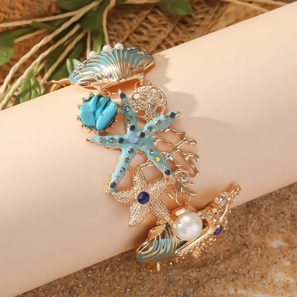 Women's alloy bracelet with boat anchor and starfish design in turquoise, red, or blue.