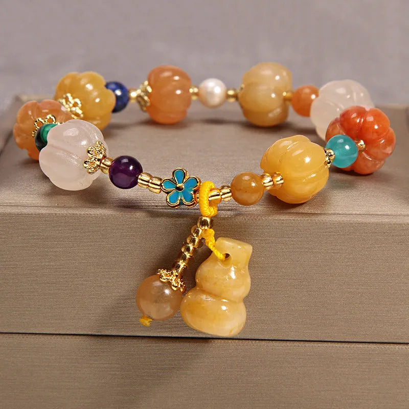 Women's yellow agate and crystal adjustable wrap bracelet on gold silk thread in khaki.