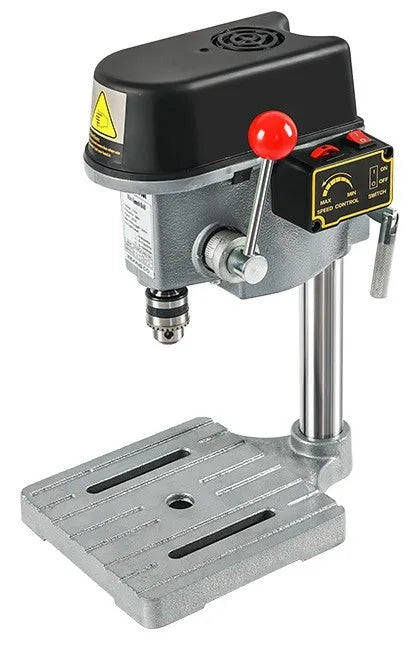 Bench-mounted drilling and milling machine with motor, chuck, and adjustable work table.