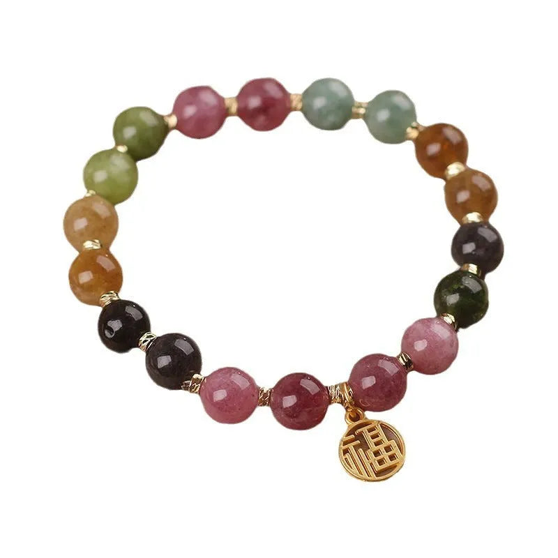 Natural colour tourmaline bracelet with electroplated finish showing geometric shape and delicate flower design