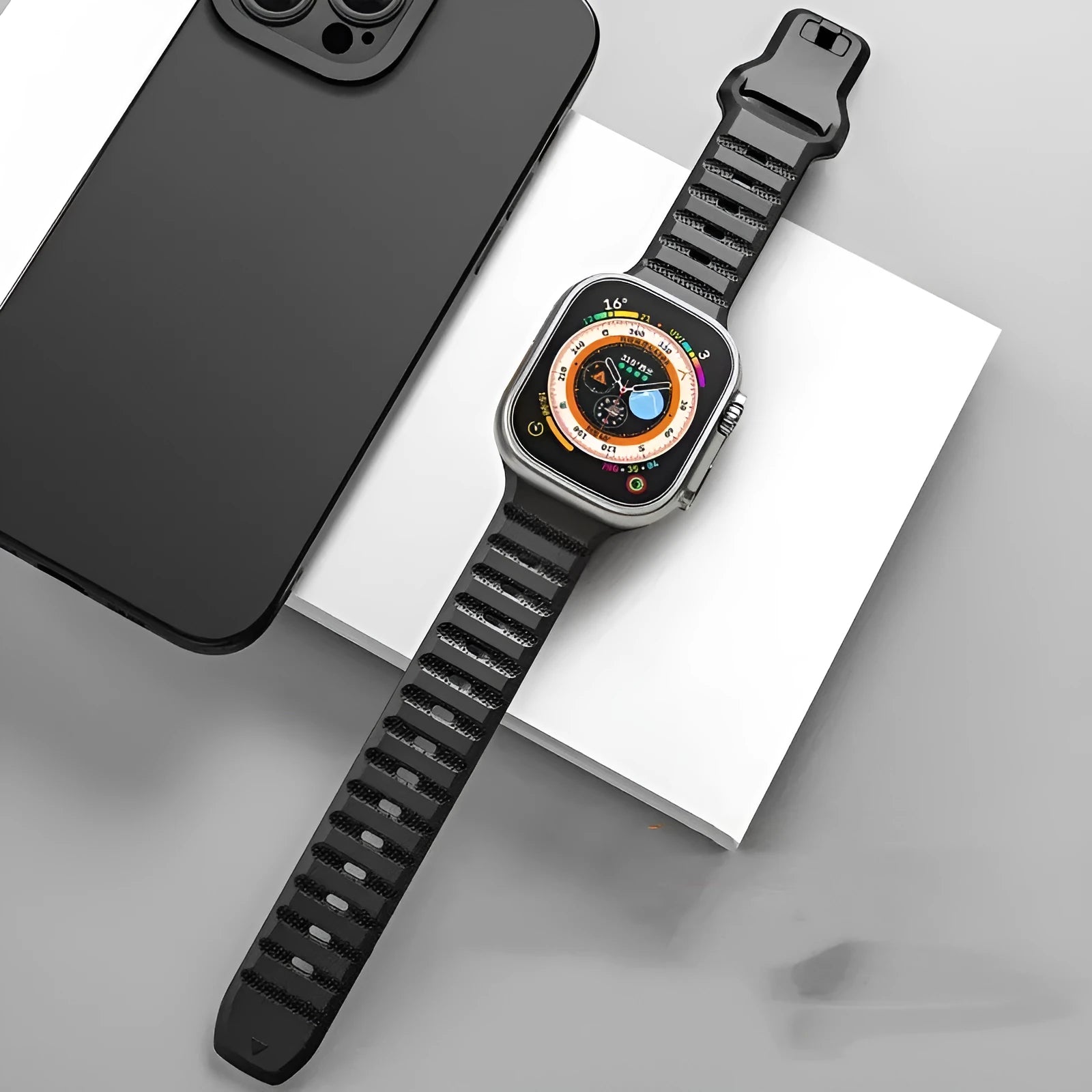 Third-party fluoro rubber Apple Watch strap with T-buckle in multiple colours on a watch case