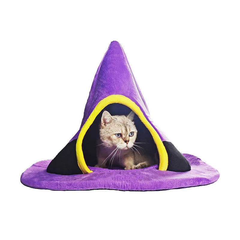 Purple Halloween witch hat-shaped fabric cat bed on a white background.