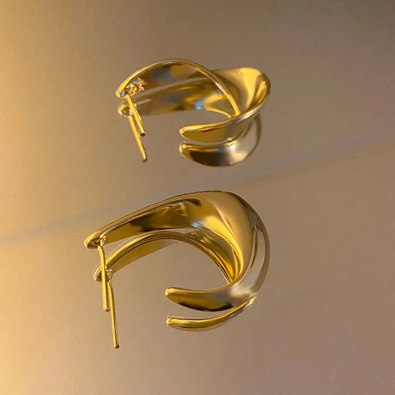 Twisted geometric metal earrings in gold and silver electroplated finishes