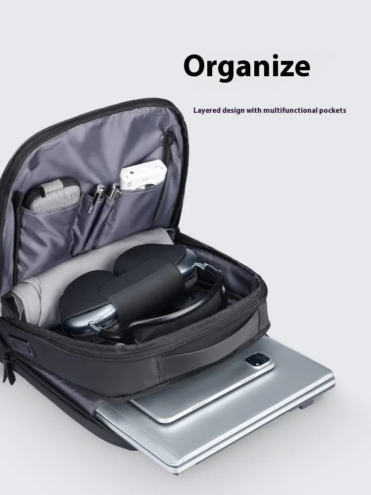 Graphite grey Oxford cloth business backpack with USB charging port and under 20 litre capacity