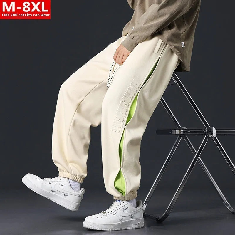 Men's black banded ankle cotton trousers with stitching detail and loose fit design
