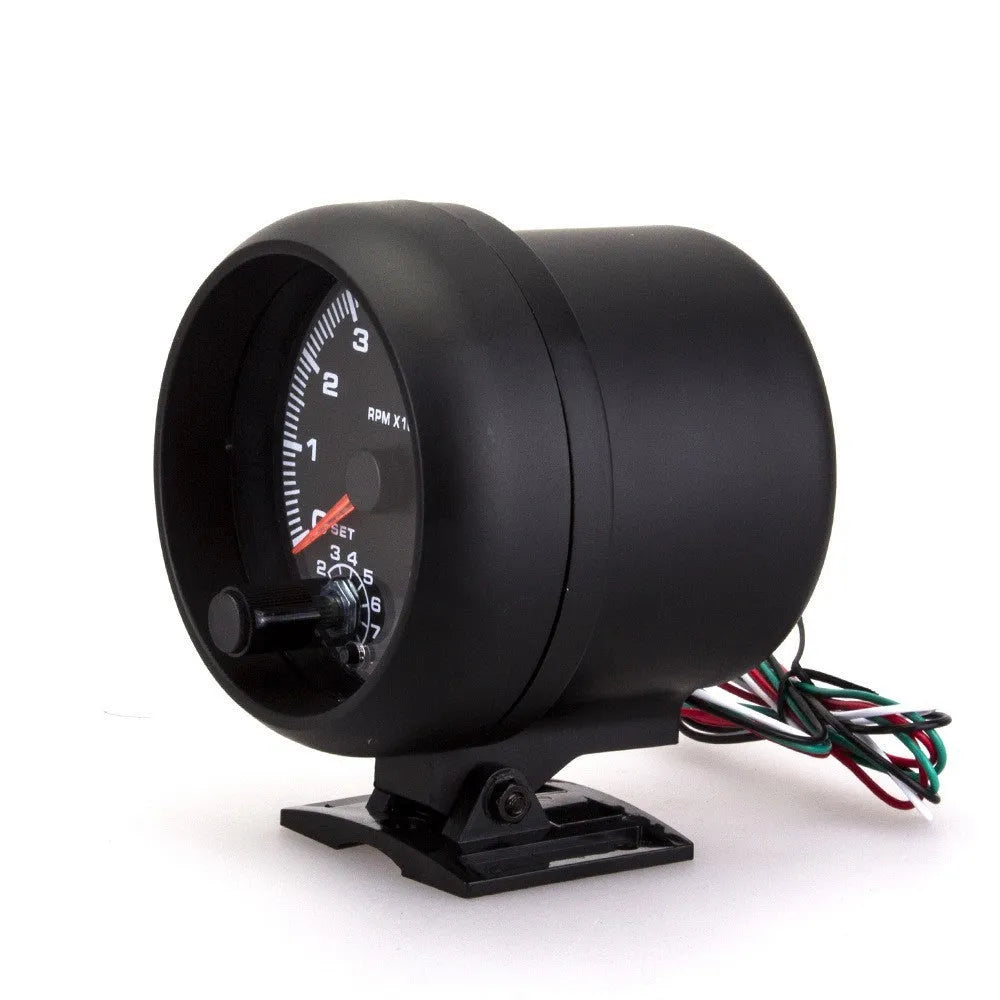 Black automotive tachometer with blue light pointer display showing engine rpm