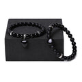 Natural stone couple bracelet set showing two heart-shaped stone pendants on bracelets with geometry design elements
