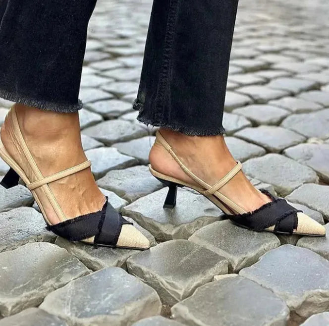 Women's apricot and black colour block stiletto heel sandals with pointed toe and ankle buckle.