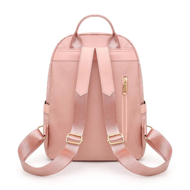 Women's soft nylon casual backpack in black colour with double shoulder straps and external pockets