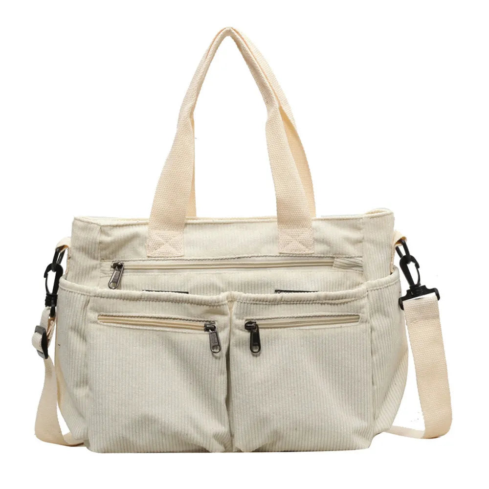 Women's corduroy messenger bag in beige, large capacity, horizontal square shape, on white background