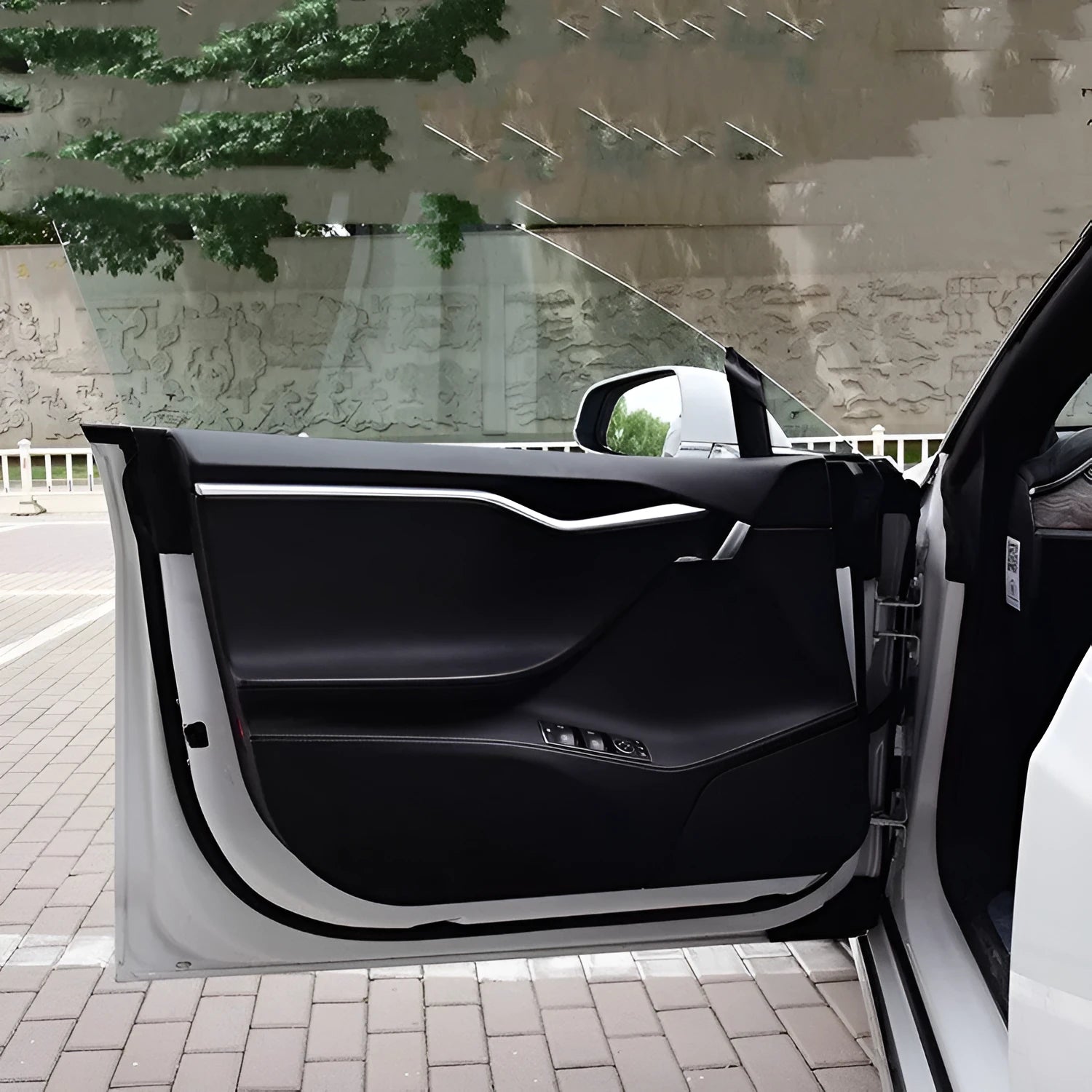 Carbon fibre protective film for Tesla Model S interior door panels showing control layout cutouts