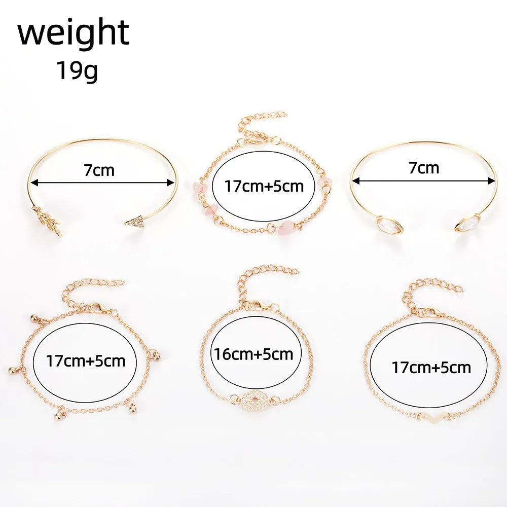Gold-coloured zinc alloy bracelet set with arrow and V-shaped water droplet design elements