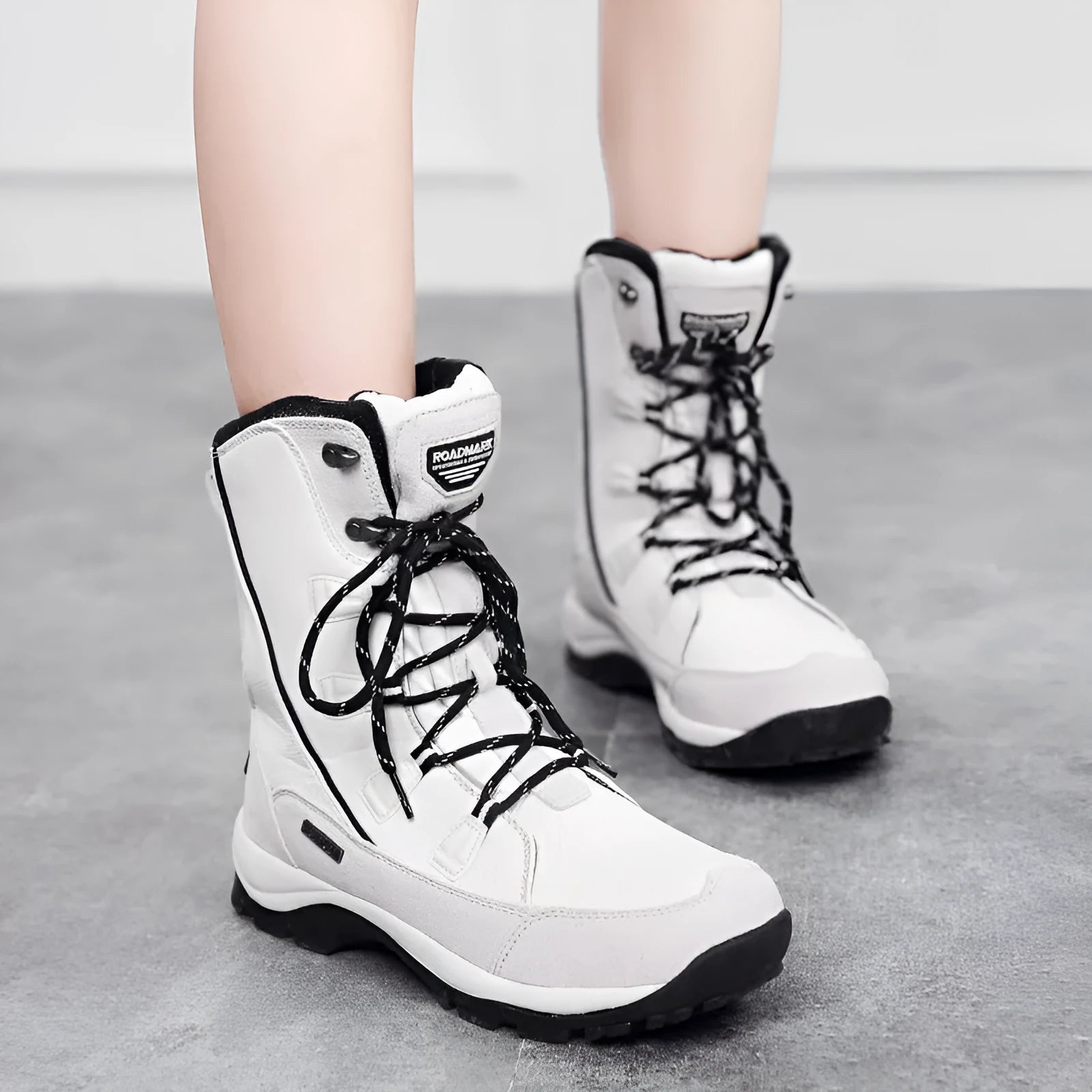 Women's mid-calf thermal snow boots in black with round toe and genuine leather upper