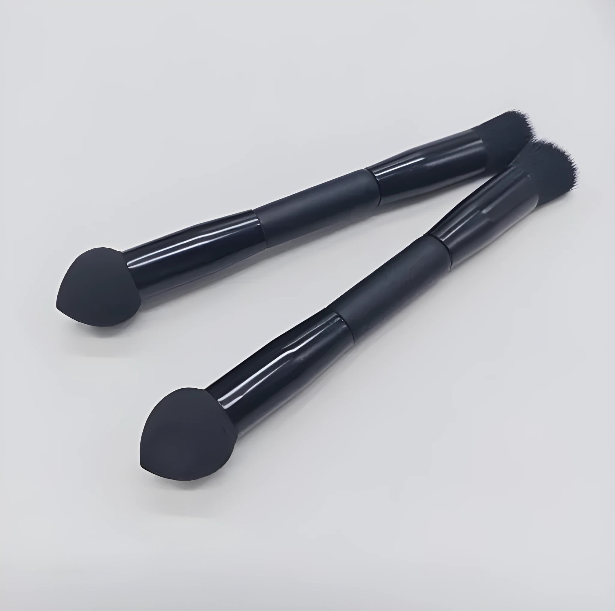Double-headed miter sponge concealer brush with wooden handle and black artificial fibers