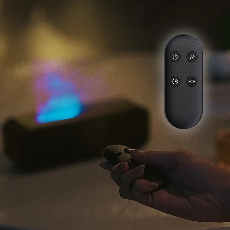 White aroma diffuser with colour-changing lights on a wooden table next to its remote control.