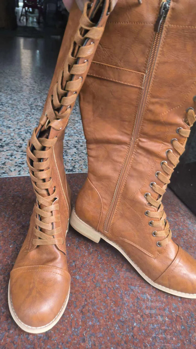 Women's black cross strap knight boots in artificial PU material with ankle straps