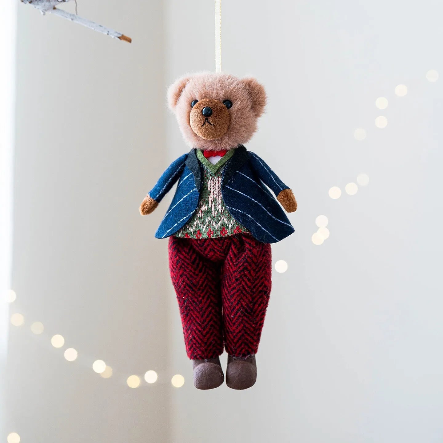 Cartoon plush bear couple, one in a gentleman's suit and one in a princess's plaid dress