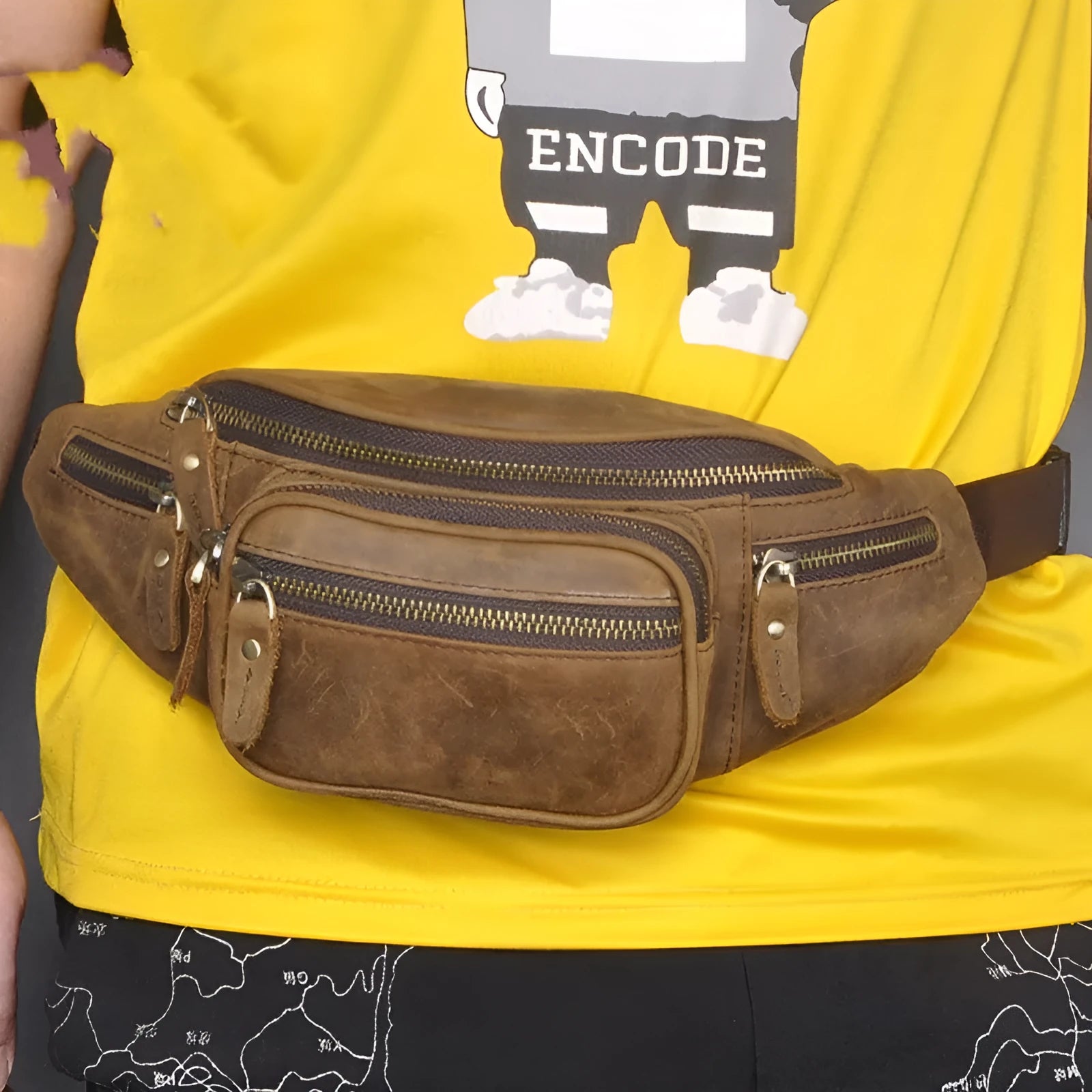 Retro brown leather messenger bag with a single shoulder strap shown open.