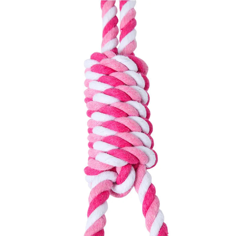 38cm long red and white twisted cotton rope dog toy for tugging with a large breed dog.
