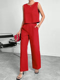 Red women's sleeveless top and wide leg trousers two-piece co-ord set on a hanger