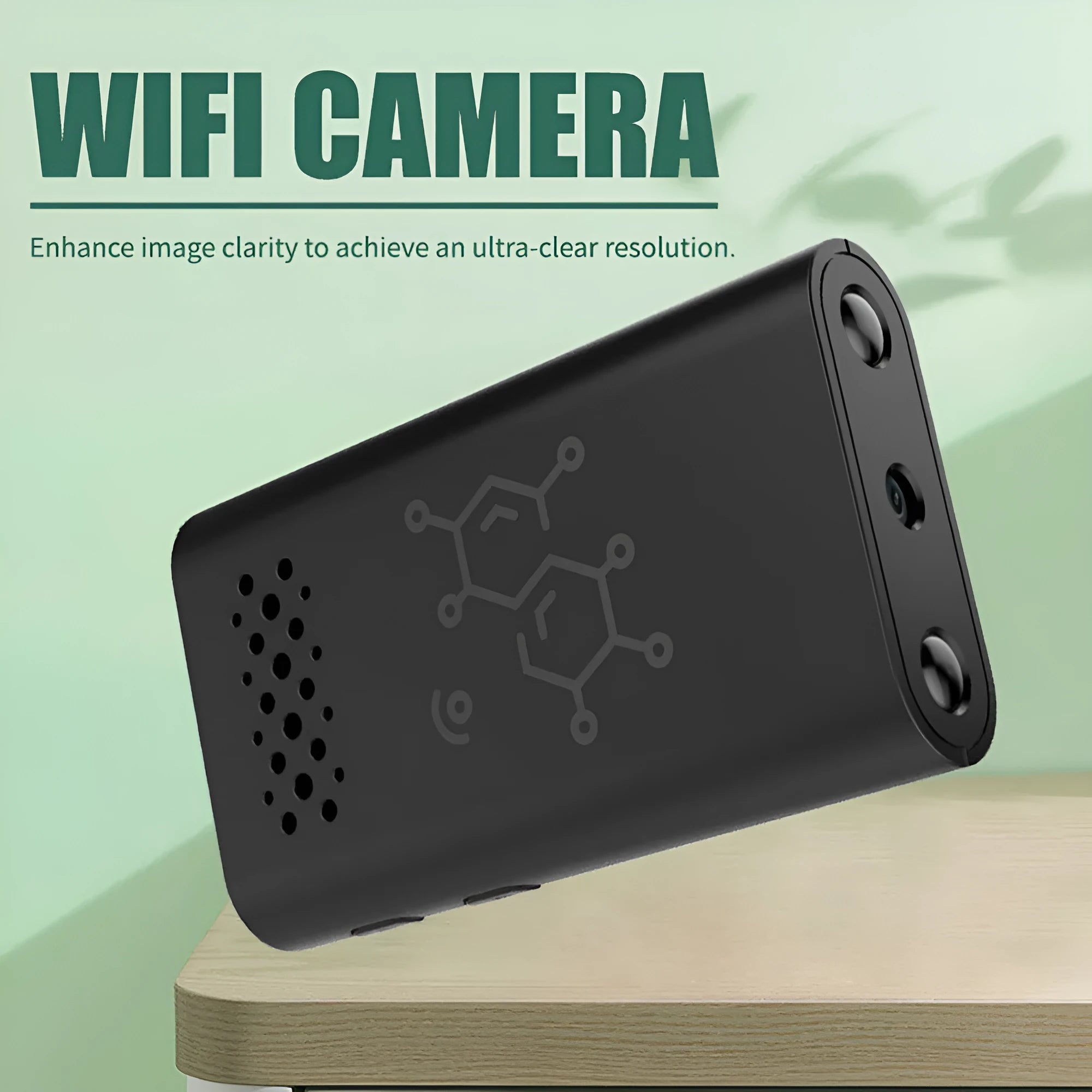 Black WiFi security camera with mobile phone showing live video feed for indoor monitoring