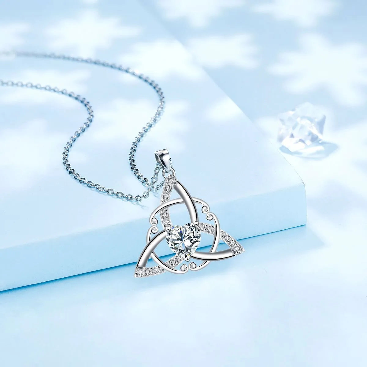 Geometric Celtic knot copper necklace for women showing blue electroplated colour option.