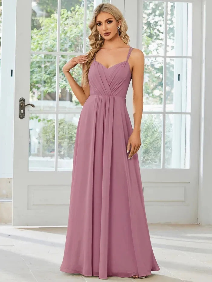 Women's sleeveless A-line long pleated dress in light green polyester fabric.