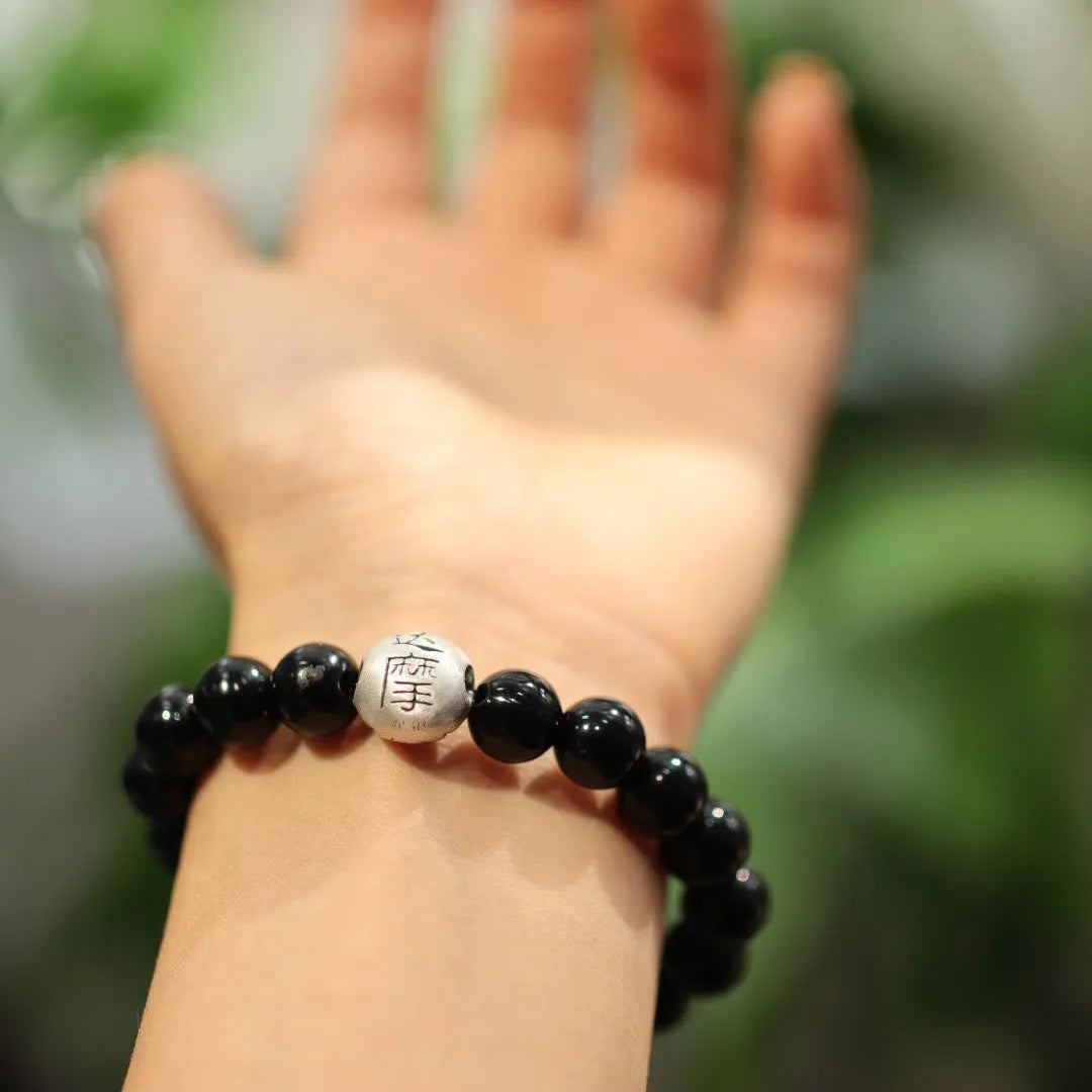 Black agate bracelet with 10mm beads, sterling silver components, and Chinese style design