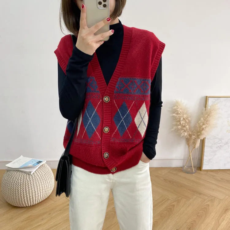 Woman wearing a khaki sleeveless cardigan with a diamond plaid pattern, loose fit.