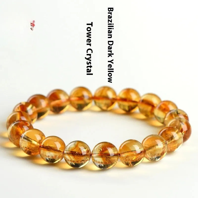 Natural yellow citrine bracelet with geometry-shaped beads in various sizes on display