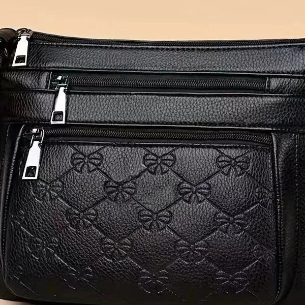 Butterfly Black horizontal square PU crossbody bag for women with external slit pocket and embossed detail