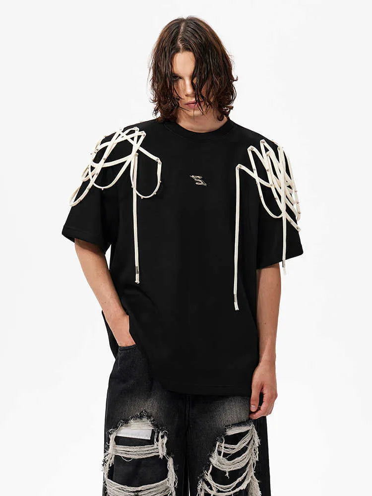 Black loose fit T-shirt with padded shoulders and short sleeves on hanger