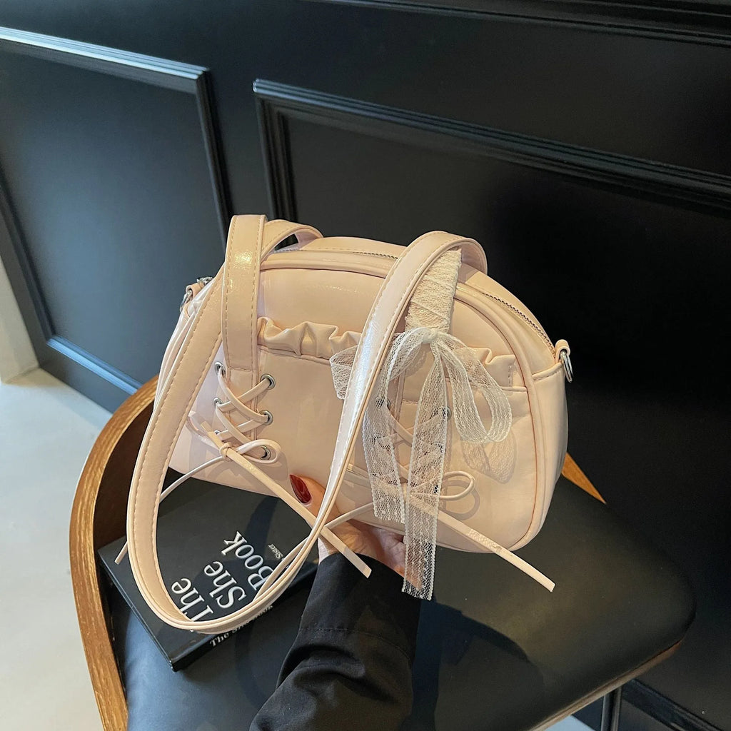 PU leather ladies shoulder handbag with phone compartment in milky white colour showing decorative stitching