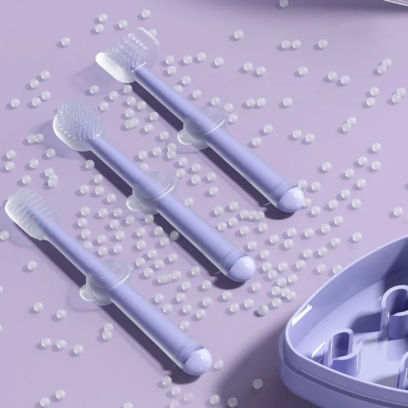 Soft silicone pet toothbrush for dogs and cats in purple, blue, and green colours with ergonomic handle.