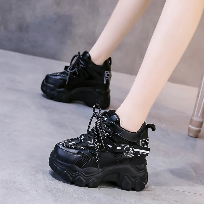 Women's white mesh platform sports shoes with cross strap and round toe on rubber sole.