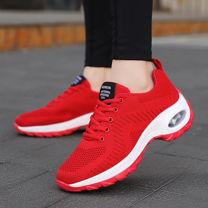Women's red mesh sneakers with round toe and front lace-up design showing 3-5cm heel height