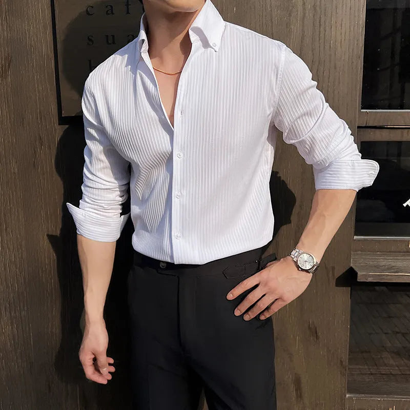 Man wearing a dark striped V-neck long sleeve casual shirt in a cardigan style.
